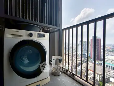 High-rise balcony with washing machine and stunning city view