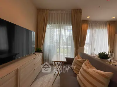 Modern living room with large windows and stylish decor