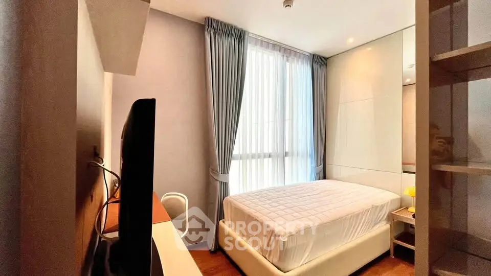 Modern bedroom with sleek design and ample natural light