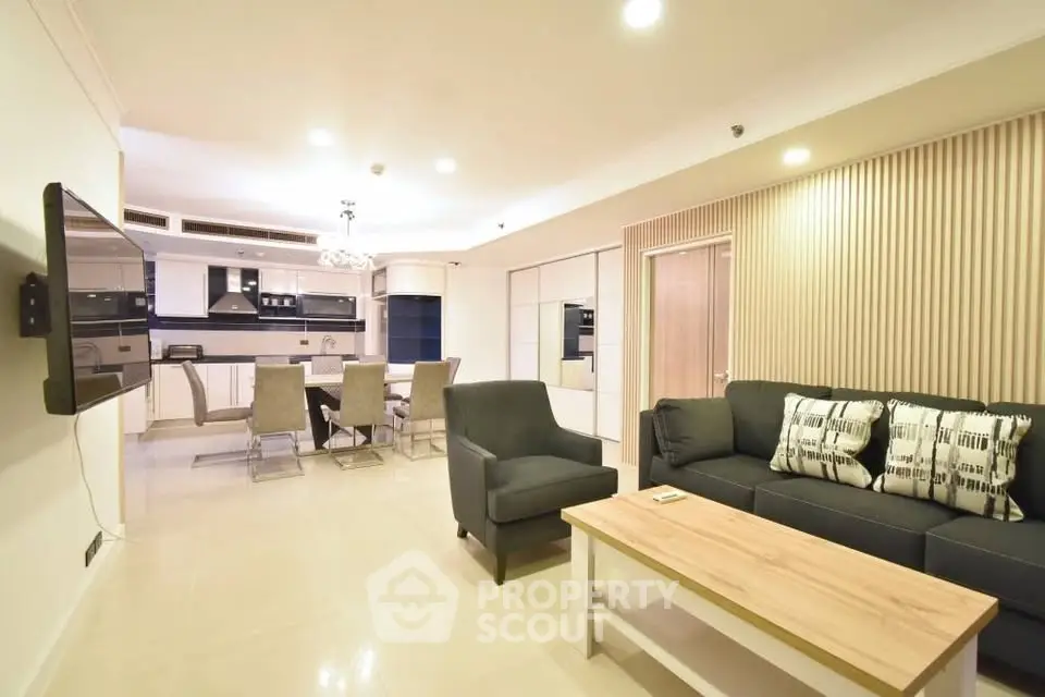 Spacious open-plan living room with modern kitchen and stylish decor