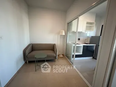 Modern apartment with cozy living area and sleek kitchen design