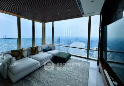 Luxurious living room with panoramic city view in high-rise apartment