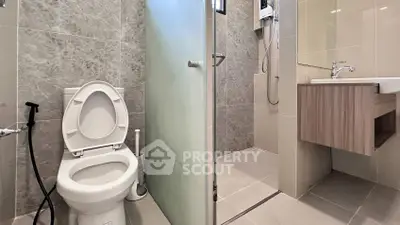 Modern bathroom with sleek design and glass shower enclosure