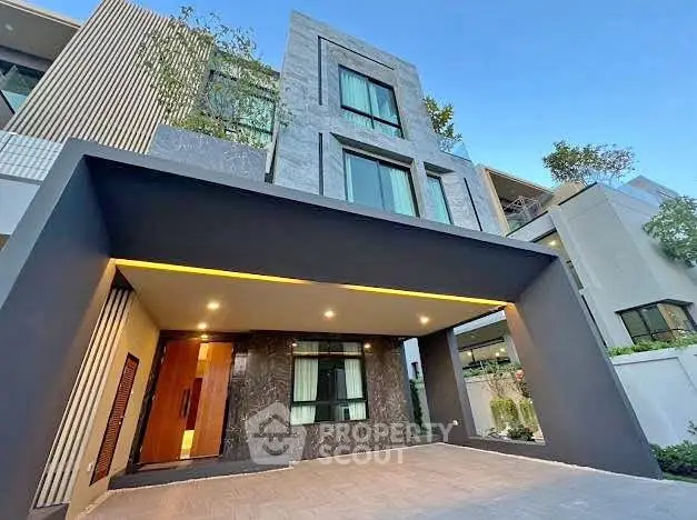 Modern luxury home exterior with sleek design and spacious entrance
