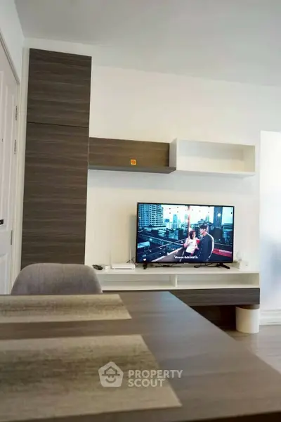 Modern living room with sleek TV setup and stylish furniture