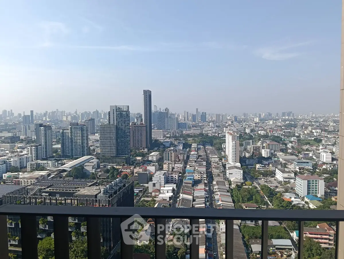 Stunning cityscape view from high-rise balcony showcasing urban skyline.