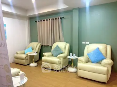 Cozy living room with plush recliners and stylish decor, perfect for relaxation and comfort.