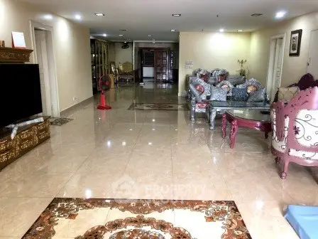 Spacious living room with elegant furniture and glossy tiled flooring