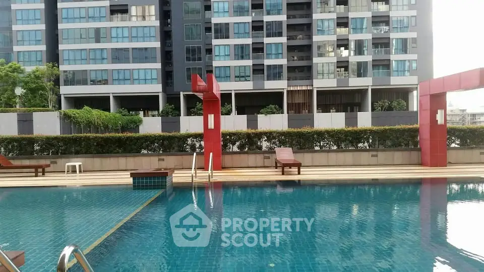 Luxurious condominium with modern pool and sleek architecture, perfect for urban living.