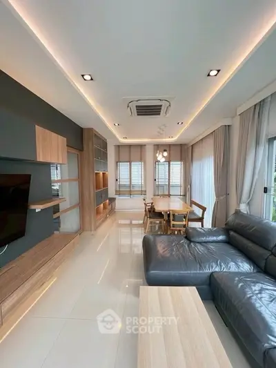 Modern living room with sleek furniture and ambient lighting