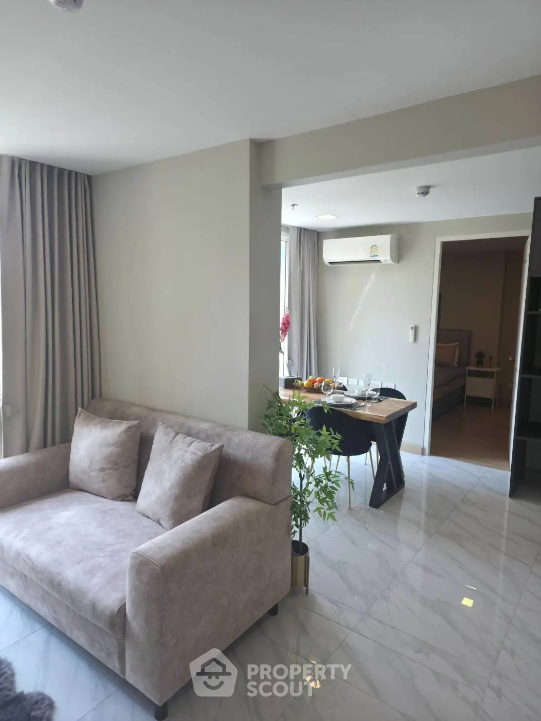 Modern living room with stylish furniture and air conditioning