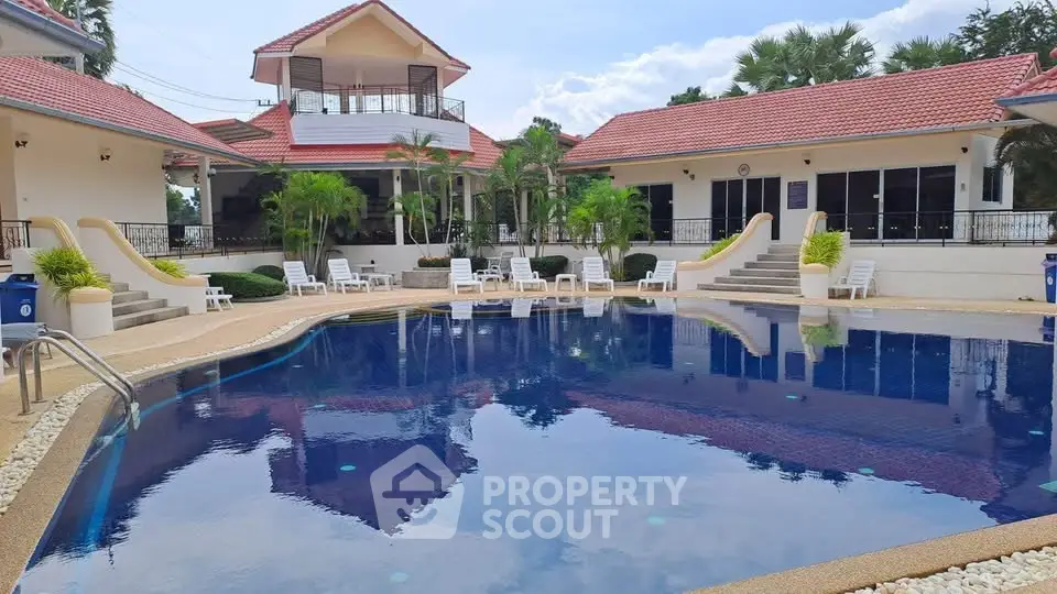 Luxurious villa with stunning pool and lush surroundings, perfect for relaxation and entertainment.