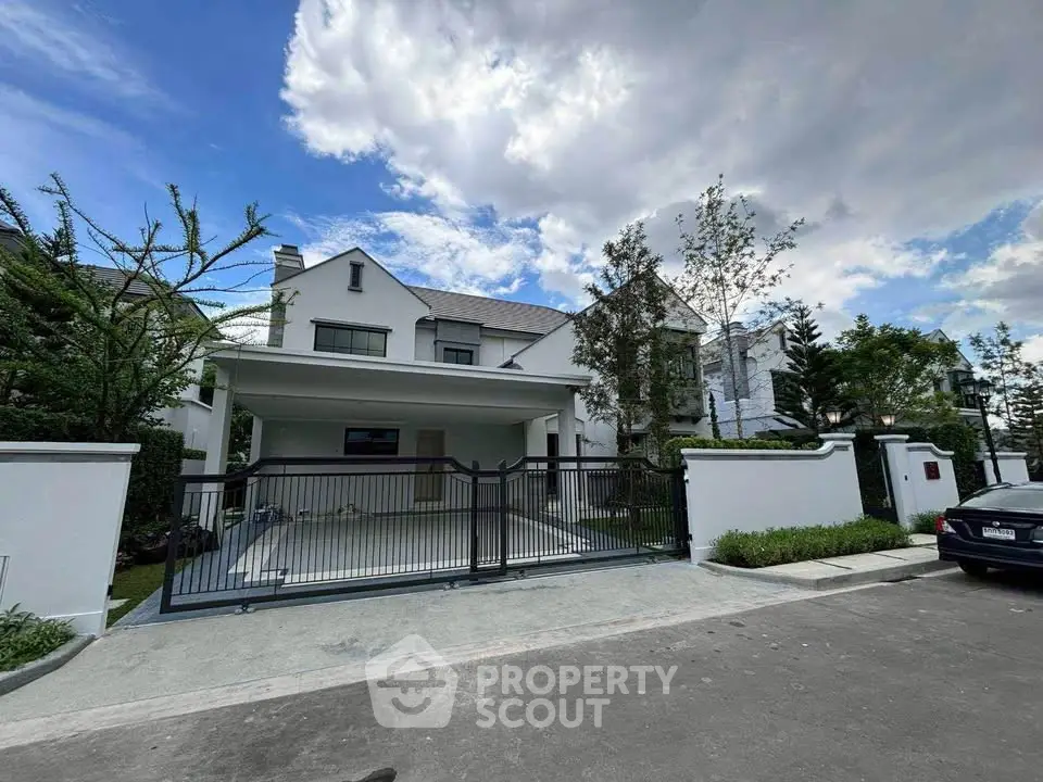 Stunning modern house with spacious driveway and lush greenery