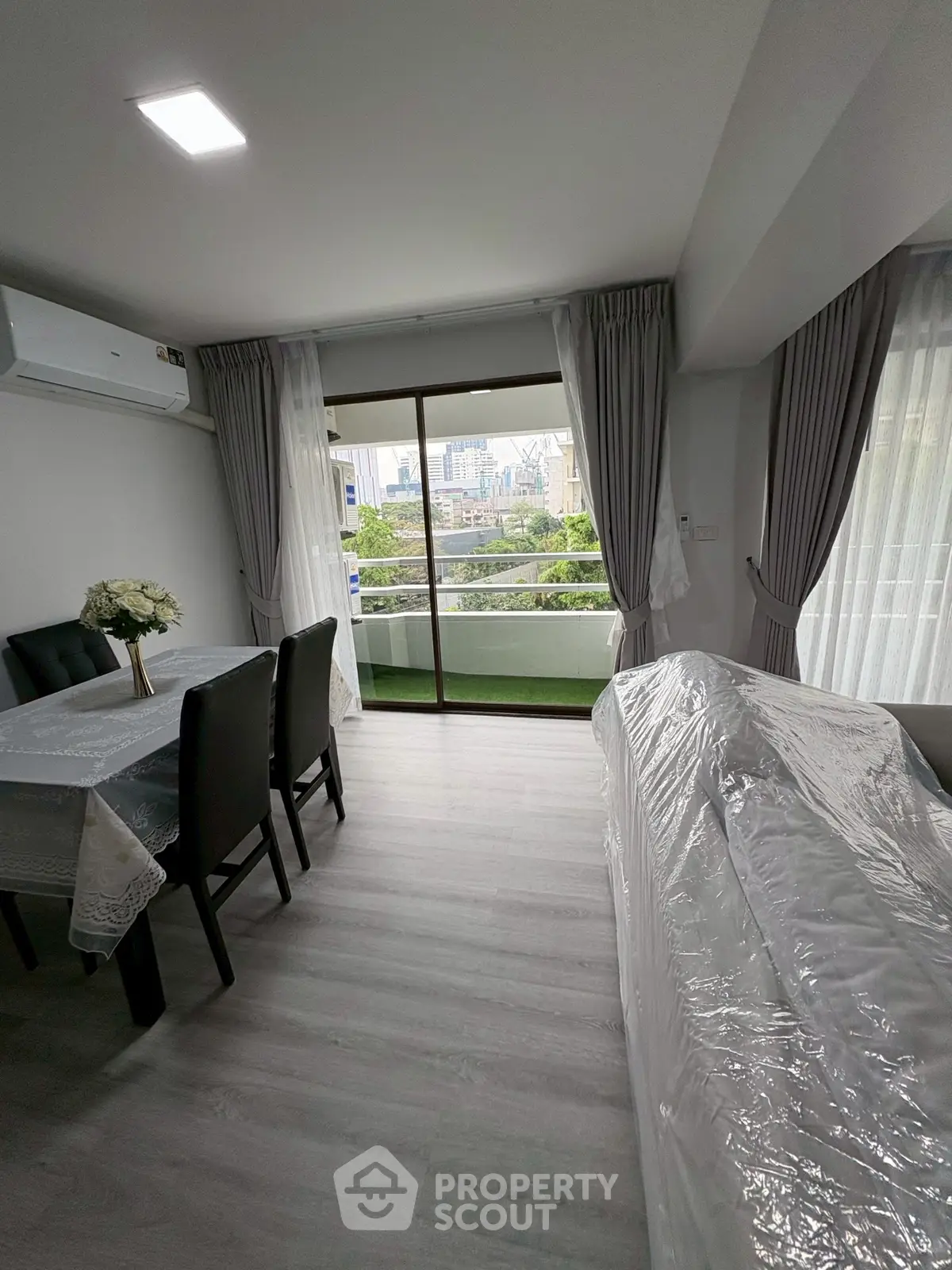 Modern living room with balcony view in urban apartment