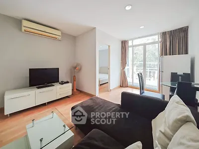 Spacious living room with modern furniture and large windows for natural light.