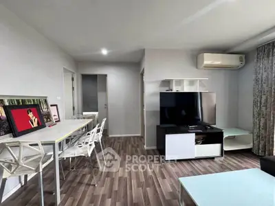 Modern living room with sleek furniture and air conditioning in a stylish apartment.