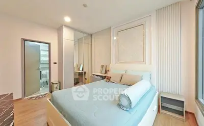 Modern bedroom with stylish decor and ample natural light