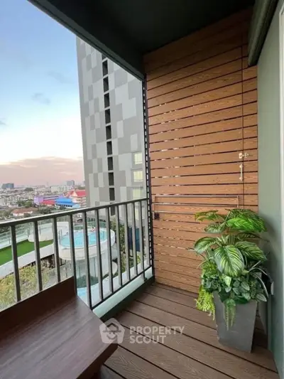Charming balcony with modern design and city view, perfect for relaxation and enjoying the sunset.