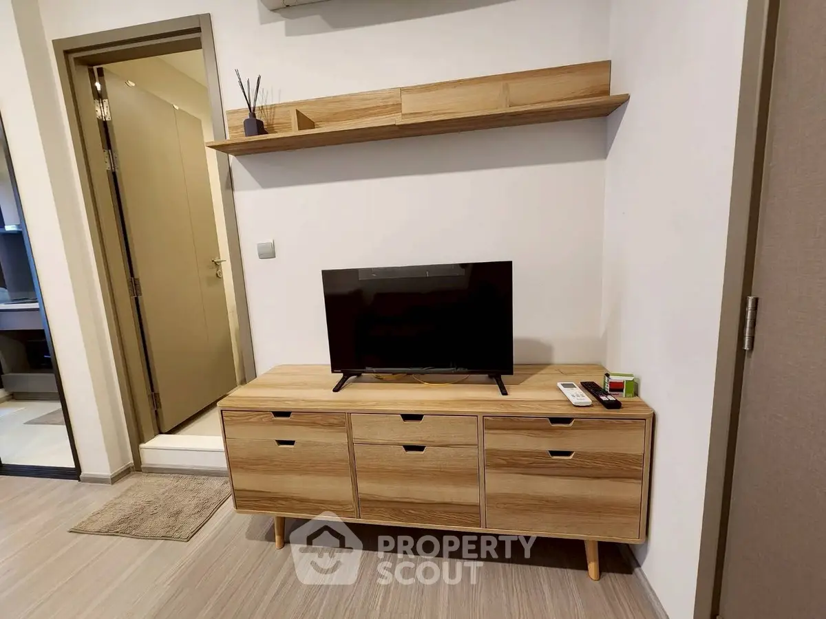 Modern living room with stylish wooden TV stand and shelf