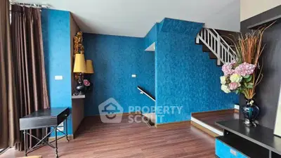 Stylish modern interior with vibrant blue walls and elegant decor