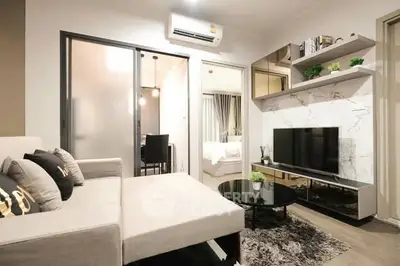 Modern living room with stylish decor and open layout in a contemporary apartment.