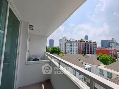 Spacious balcony with city view in modern apartment, perfect for relaxation and enjoying the skyline.