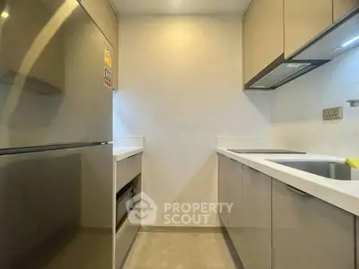 Modern kitchen with sleek cabinetry and stainless steel appliances