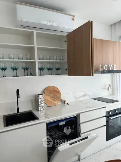 Modern kitchen with open cabinets, dishwasher, and sleek appliances