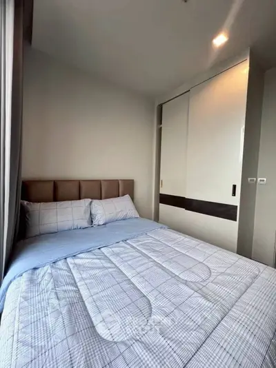 Cozy bedroom with modern design and ample natural light