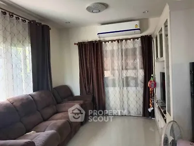 Cozy living room with plush sofas and modern air conditioning