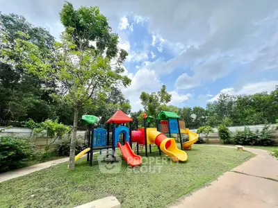 Charming outdoor playground in lush garden setting, perfect for family-friendly real estate.