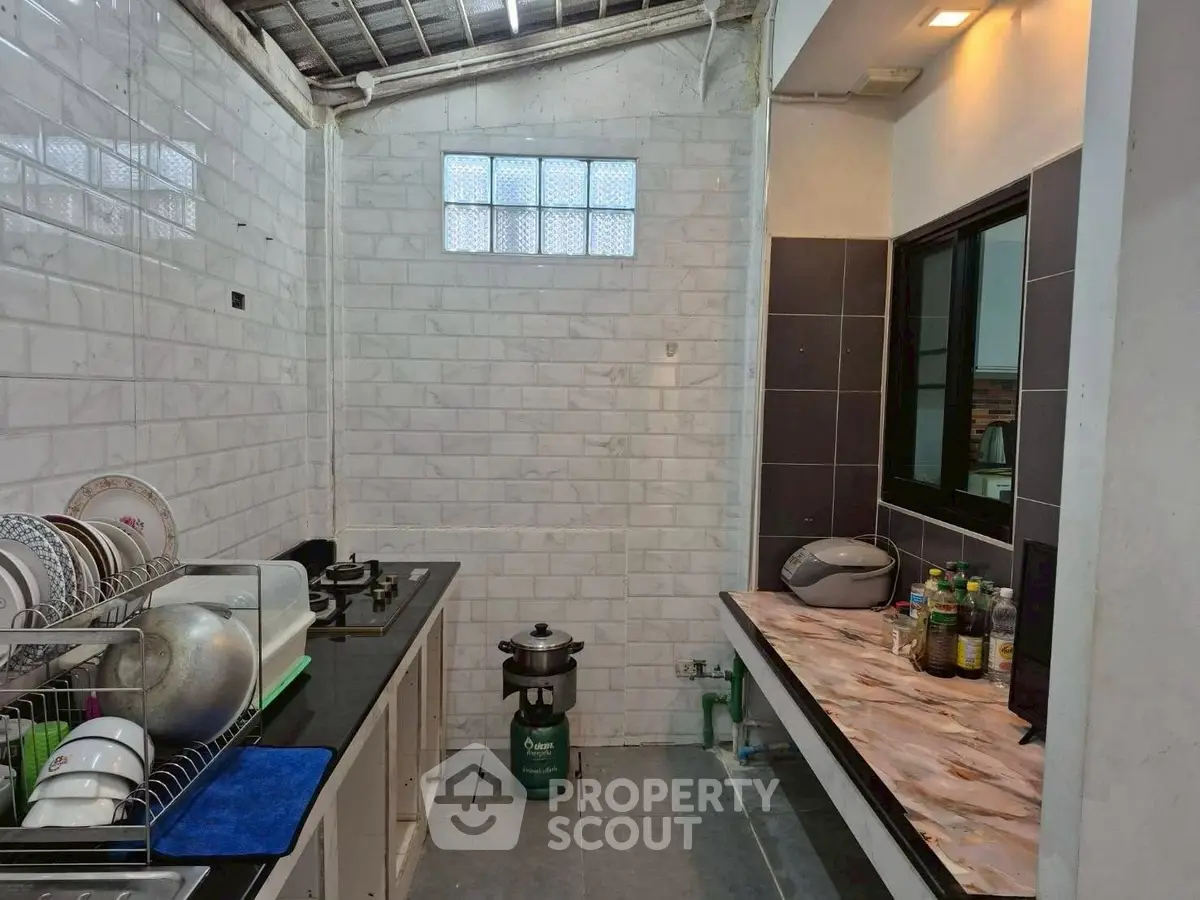 Spacious kitchen with modern appliances and ample counter space