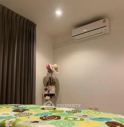 Cozy bedroom with air conditioning and stylish decor