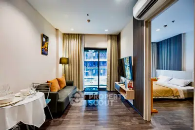 Modern studio apartment with seamless living and sleeping areas, featuring sleek furniture, hardwood floors, and ample natural light.