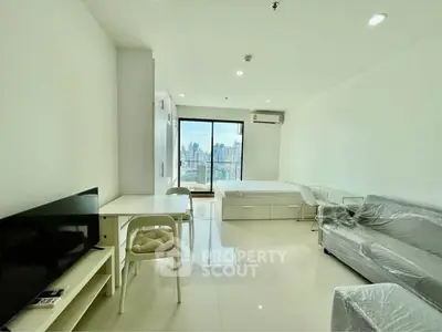 Spacious modern studio apartment with city view and sleek furnishings