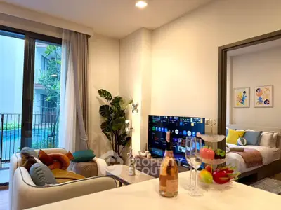 Modern living room with pool view, stylish decor, and open layout in luxury apartment.