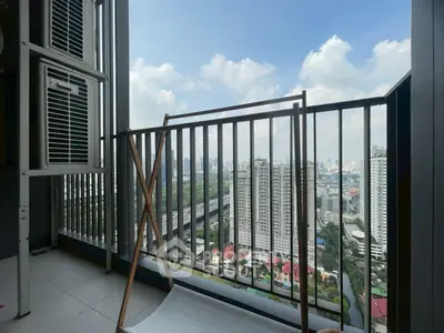 Stunning high-rise balcony with panoramic city views and modern railing design.