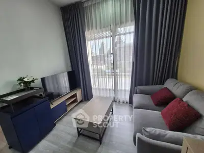 Modern living room with stylish furniture and large window view