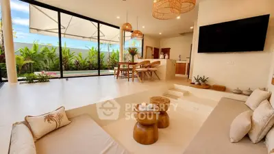 Luxurious open-plan living room with pool view and modern decor