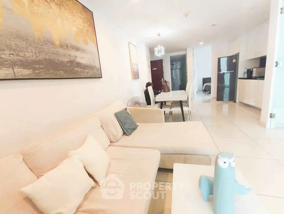 Spacious modern living room with elegant decor and open kitchen layout