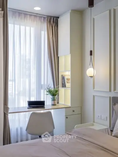 Modern bedroom with study area and natural light