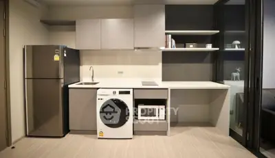 Modern kitchen with sleek appliances and ample storage space