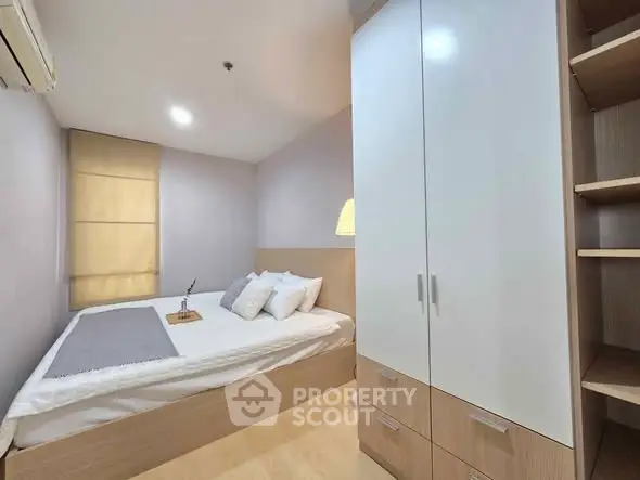 Cozy bedroom with modern wardrobe and soft lighting