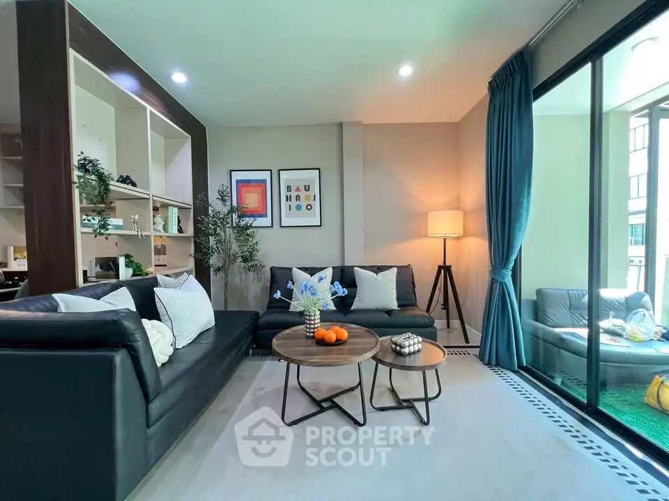 Modern living room with stylish decor and large windows
