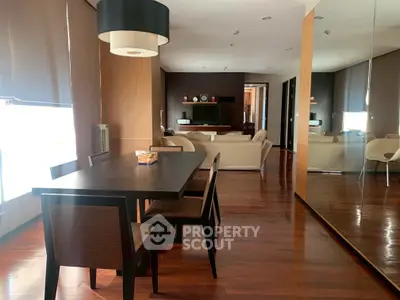 Spacious modern living room with elegant dining area and hardwood floors