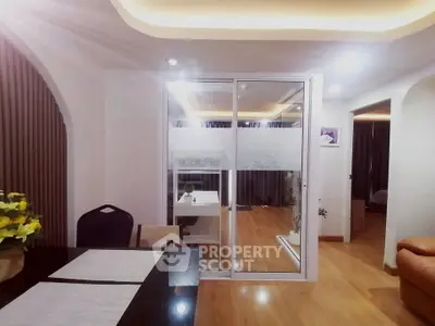 Modern interior with sliding glass doors and elegant lighting in a stylish living space.