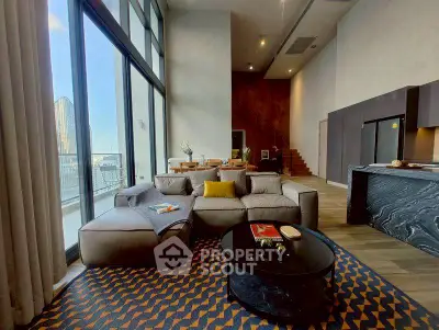 Luxurious modern living room with high ceilings and stunning city view.