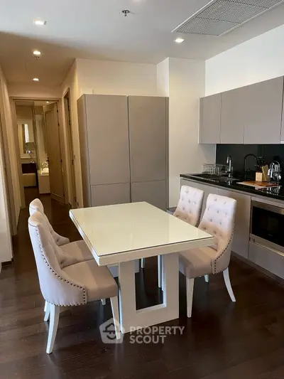 Modern kitchen with elegant dining area and sleek cabinetry