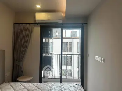 Modern bedroom with balcony view and air conditioning in urban apartment