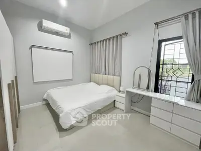 Modern bedroom with sleek design and natural light